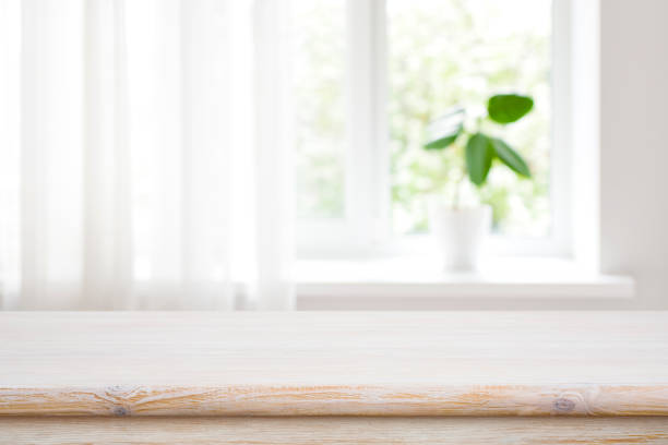 istock Wood table on blur window sill background for product montage 1491447277