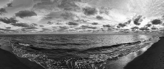 Winter's Mystique its ethereal panorama of black and white seascape with ghostly clouds wrapped the sky.