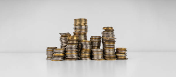 istock Stacks of coins on a white background 1491450584