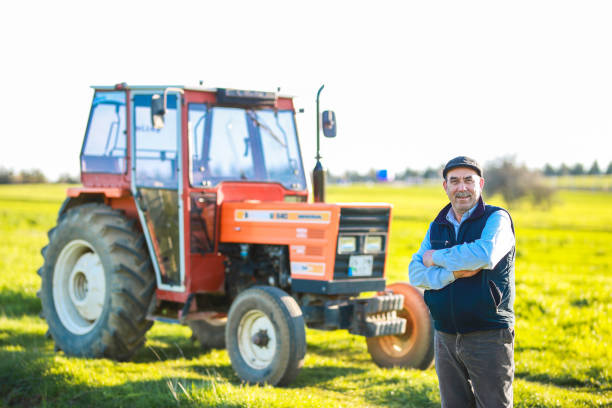 istock senior farmer drives tractor in the field 1491450634