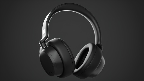 White headphones on a black wooden background