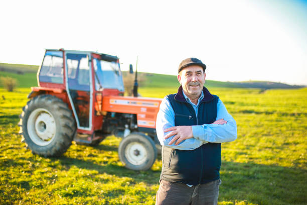 istock senior farmer drives tractor in the field 1491451979