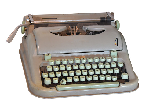 Photo of a red typewriter, isolated on white.
