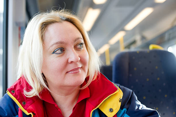 istock Happy woman in a train 149145633