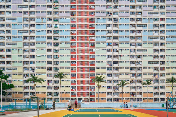 Hong Kong Choi Hung Estate and basketball courts, colourful facades of a dense public Housing in Kowloon Hong Kong SAR, China - April 2023: Choi Hung Estate and basketball courts, colourful facades of a dense public Housing in Kowloon berk stock pictures, royalty-free photos & images