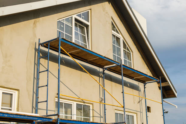 istock House insulation concept. Facade insulation with mineral wool, thermal improvement and energy saving. Modern farmhouse renovation, scaffolding platform and stone wool covered with plaster 1491459220
