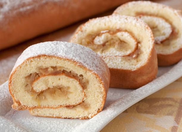 istock Homemade biscuit roll with apples on a white plate. 1491460143