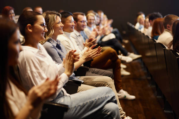 istock Happy people applauding on education event at convention center. 1491461161