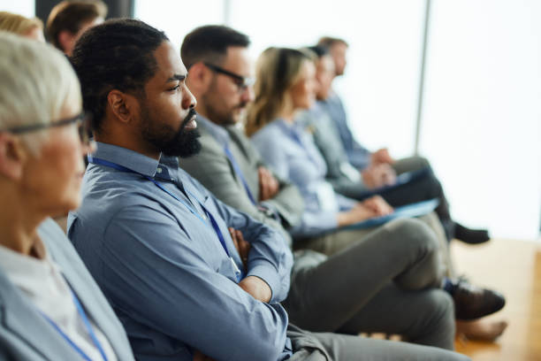 istock Black entrepreneur with his colleagues on education event in board room. 1491462610