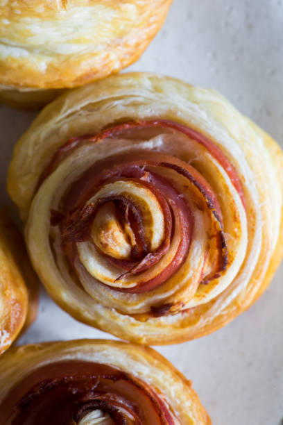 Puff pastry swirls. Close-up of puff pastry with prosciutto.