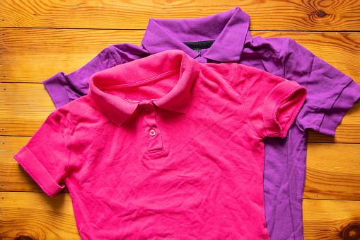 polo color rumpled lie on the table close-up, women's polo