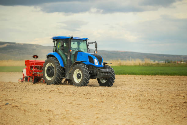 istock farmer planting seeds with tractor and seeder 1491464606