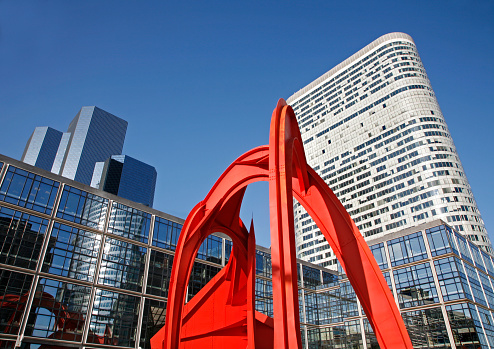Paris - The skyscrapers and the moder red metal sculpture.