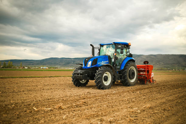 istock farmer planting seeds with tractor and seeder 1491464833