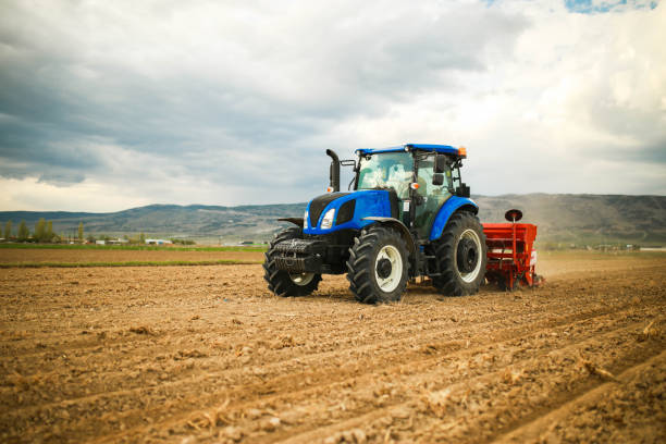 istock young farmer sowing seeds with satellite system in the prepared field 1491464881