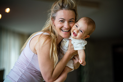 istock Happy single mother and her baby girl enjoying at home. 1491465621