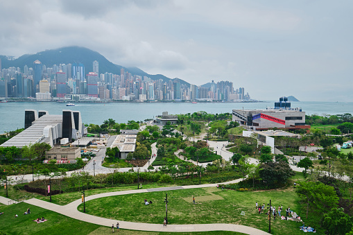 April 2023: West Kowloon Cultural District M+ Plus Museum roof garden view WKCD Art Park and HK Island skyline view