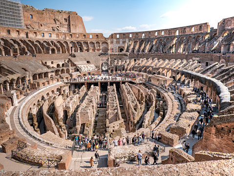 Rome, Italy – March 2022: Interior view of the monumental three-story Colosseum in Rome. In the internal corridors the gladiators passed who went to fight and put on a show.