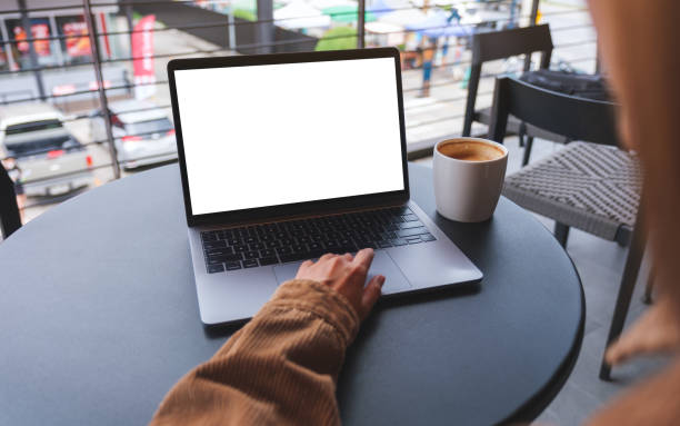 istock Mockup image of a woman using and working on laptop computer with blank white desktop screen 1491472413