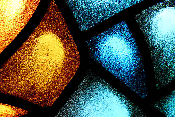 istock Close-up orange and blue stained glass window 149147354