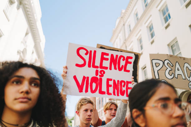 istock Diverse young people standing up against war and violence 1491473817