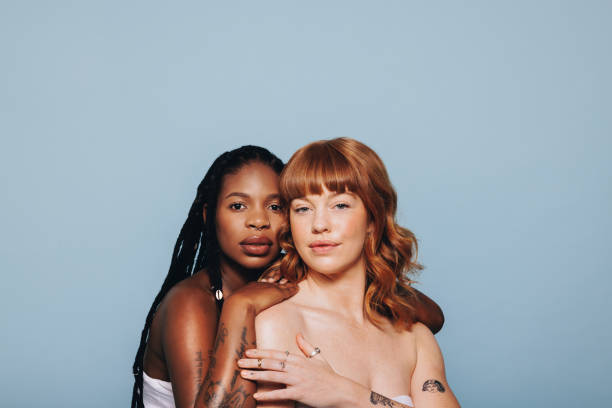 istock Confident women with different skin tones standing together 1491474248