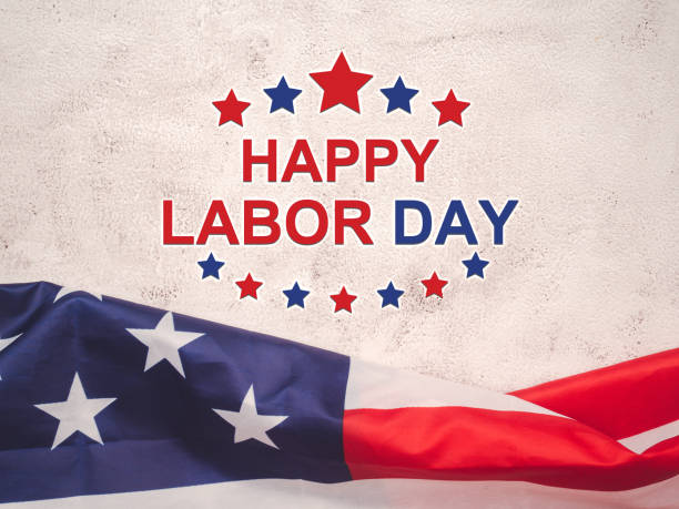istock Happy labor day text over a cement floor background and American Flag. 1491479751