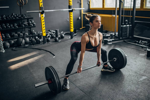istock Woman weightlifting 1491479781