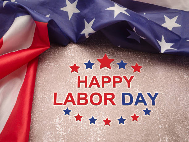 istock Happy labor day text over a cement floor background and American Flag. 1491479951