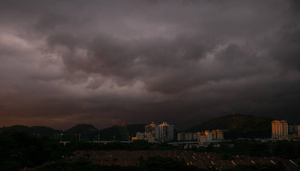storm cloud gathering during sunset at rural scene during sunset