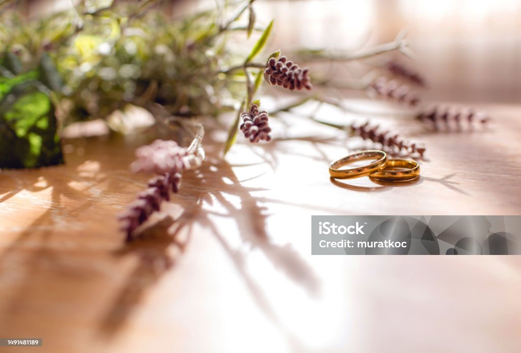 Pair of golden wedding rings on the table  with copy space. Ring - Jewelry Stock Photo
