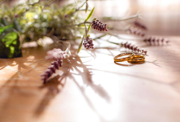 Pair of golden wedding rings on the table  with copy space. stock photo