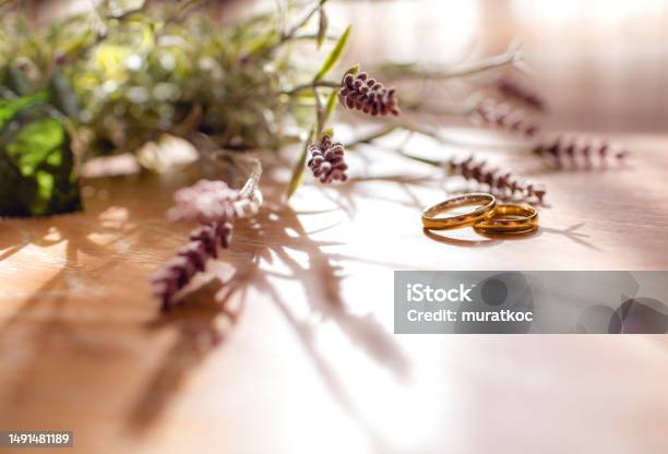 Pair Of Golden Wedding Rings On The Table With Copy Space Stock Photo - Download Image Now