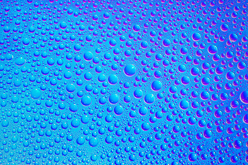 Aesthetic waterdrops on blue and purple Rainbow gradient background. Holographic soft pastel colors backdrop. Trendy creative gradient. Colorful rainbow gradient poster, banner wallpaper.