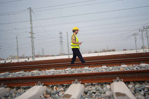Workers inspecting railways