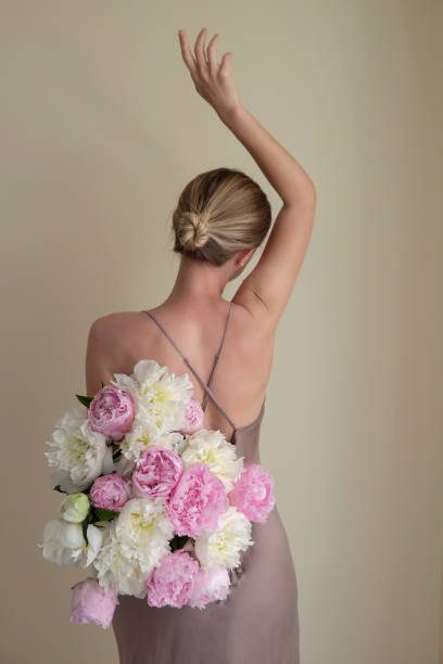 istock Mysterious woman with the flowers. 1491484791