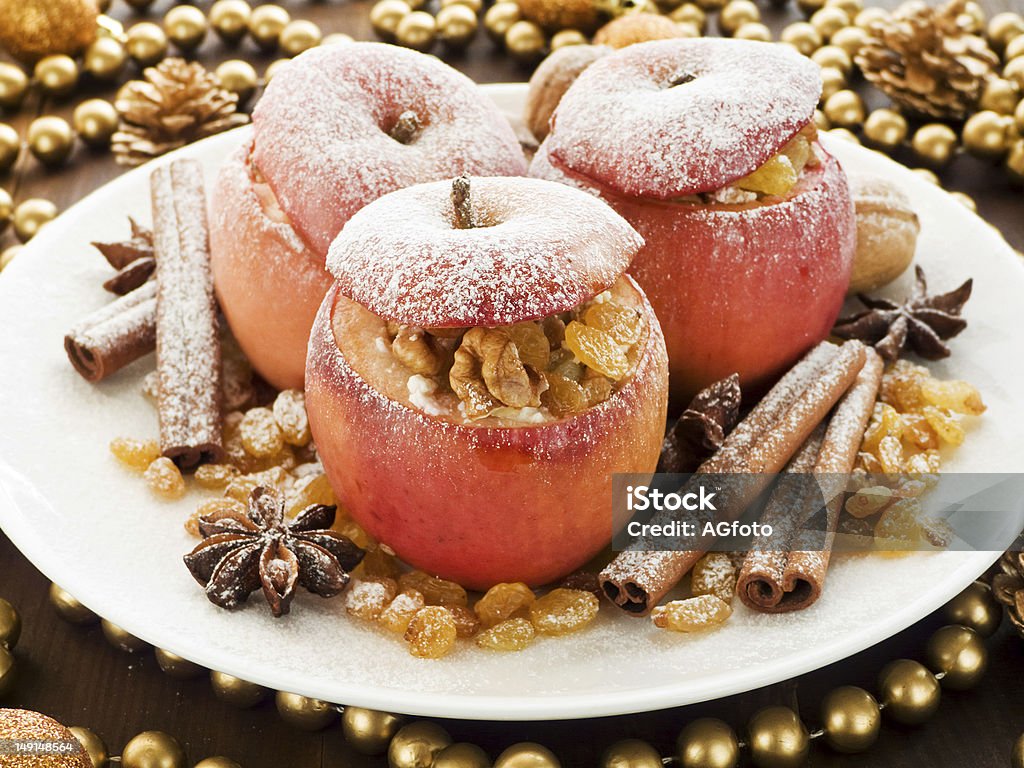 Baked apples Baked apples with raisin, cottage cheese and walnuts. Shallow dof. Anise Stock Photo