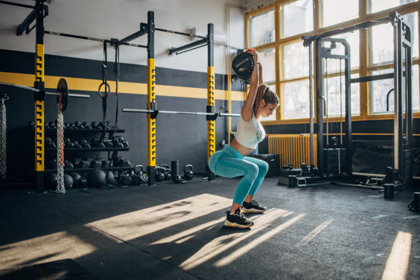 istock Young woman training in gym 1491486565