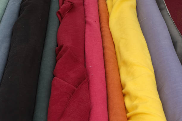 istock Colorful samples of cloth and fabrics in different colors found at a fabrics market 1491490520