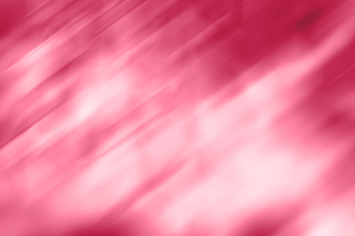 Trendy viva magenta color of year 2022, carmine red blurred gradient background. Mixed motion texture. Abstract diagonal lines wallpaper