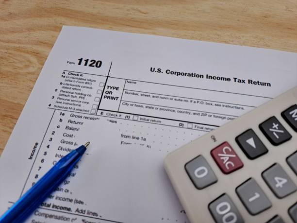 Tax 1120 USA Income Form Tax 1120 USA Income Form, U.S. Corporation Income Tax Return. Calculator and ballpoint pen. section 125 tax stock pictures, royalty-free photos  images