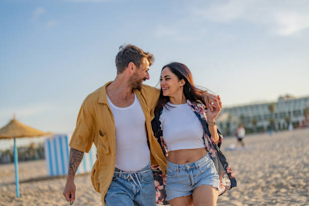 istock Young couple enjoying a summer day on seashore 1491495243