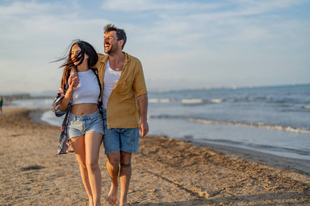 istock Handsome man hugging his wife by the ocean. 1491496729