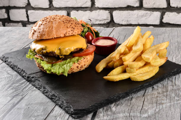 istock Delicious burger and fries 1491497123