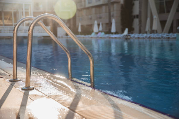istock Swimming pool stairs on a sunny day 1491497267