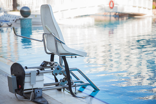 Swimming pool lifts for disabled people access to the pool