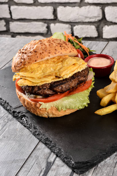 istock Delicious burger and fries 1491497641