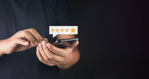 istock Customer or User give rating to service experiences review satisfaction feedback survey on online application, Customer can evaluate quality of service leading to reputation ranking of business. 1491501141