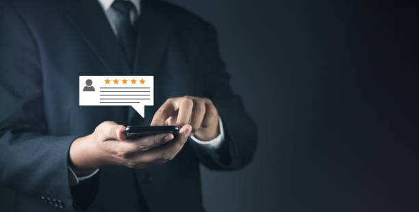 istock Customer or User give rating to service experiences review satisfaction feedback survey on online application, Customer can evaluate quality of service leading to reputation ranking of business. 1491501365