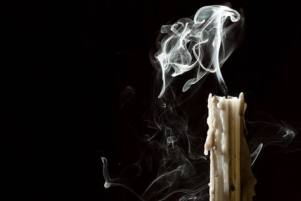 Candle blow off with smoke stock photo